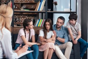 Family supporting loved one in addiction relapse recovery